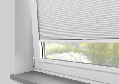 White window blinds partially closed
