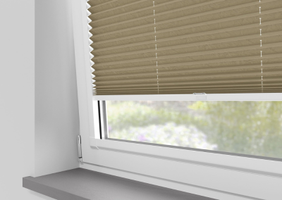 Window with beige honeycomb blinds
