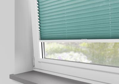 Turquoise window blinds with sunlight