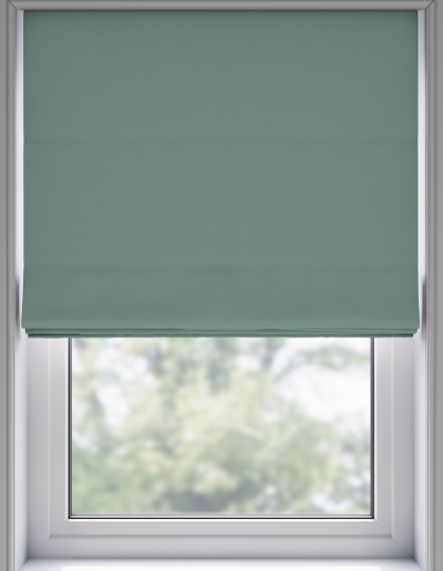 Mint green roller blind covering window