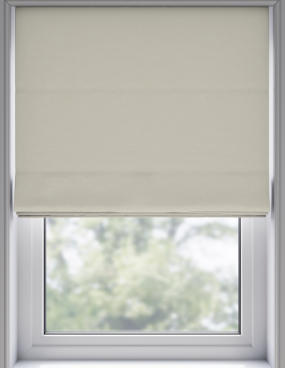 Light-colored roller blind covering window